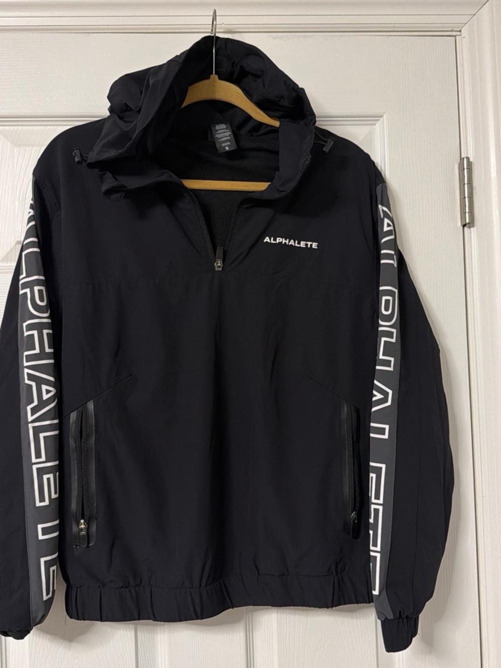 Alphalete Black Hooded Windbreaker with Branded Sleeve Panels